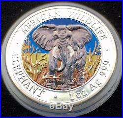 2004 Somalia African Wildlife colorized 1 oz Silver Elephant Coin in Capsule